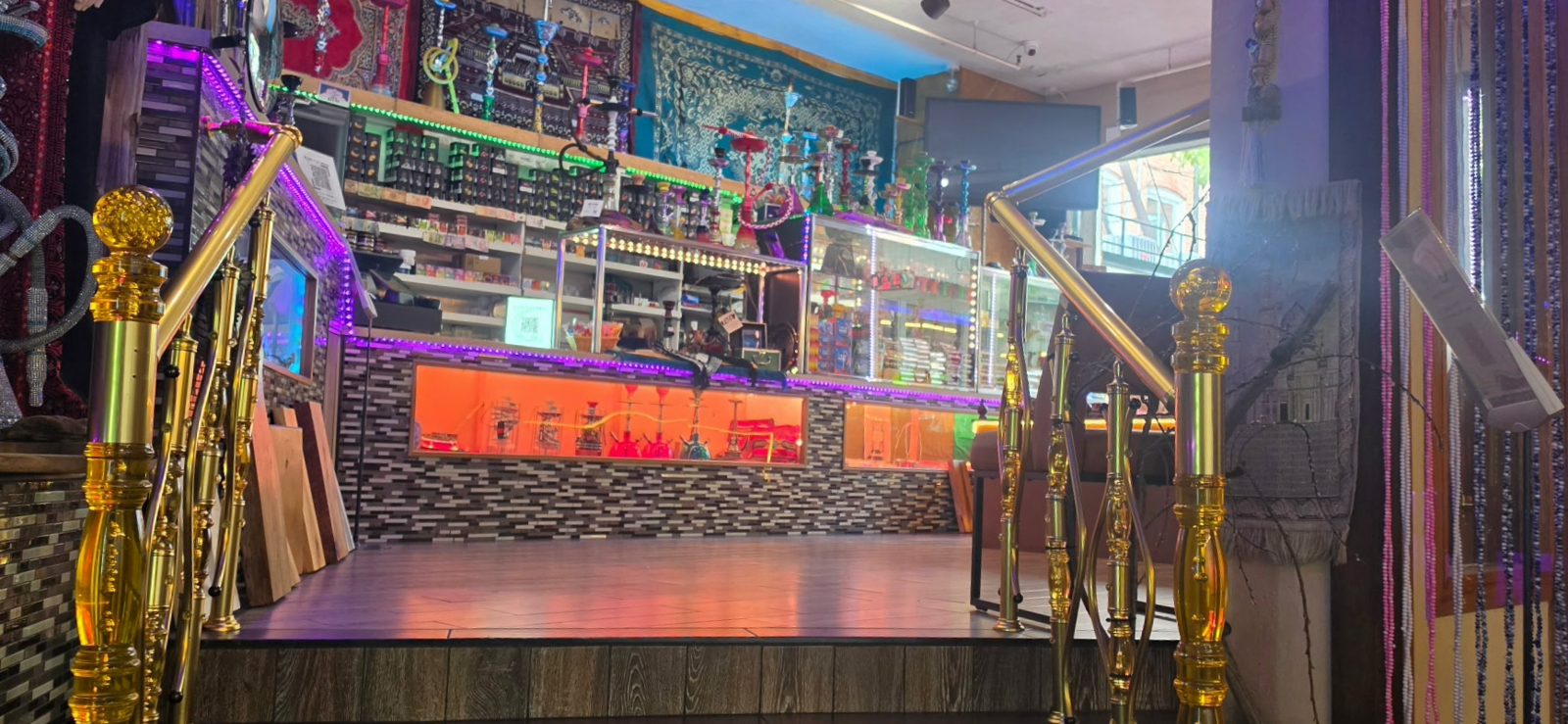 The hookah shop counter with shelves of tobacco and hookahs