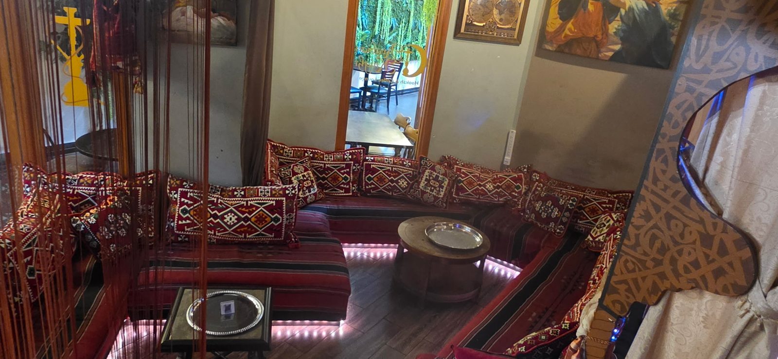 Private sunken lounge with red patterned cushions