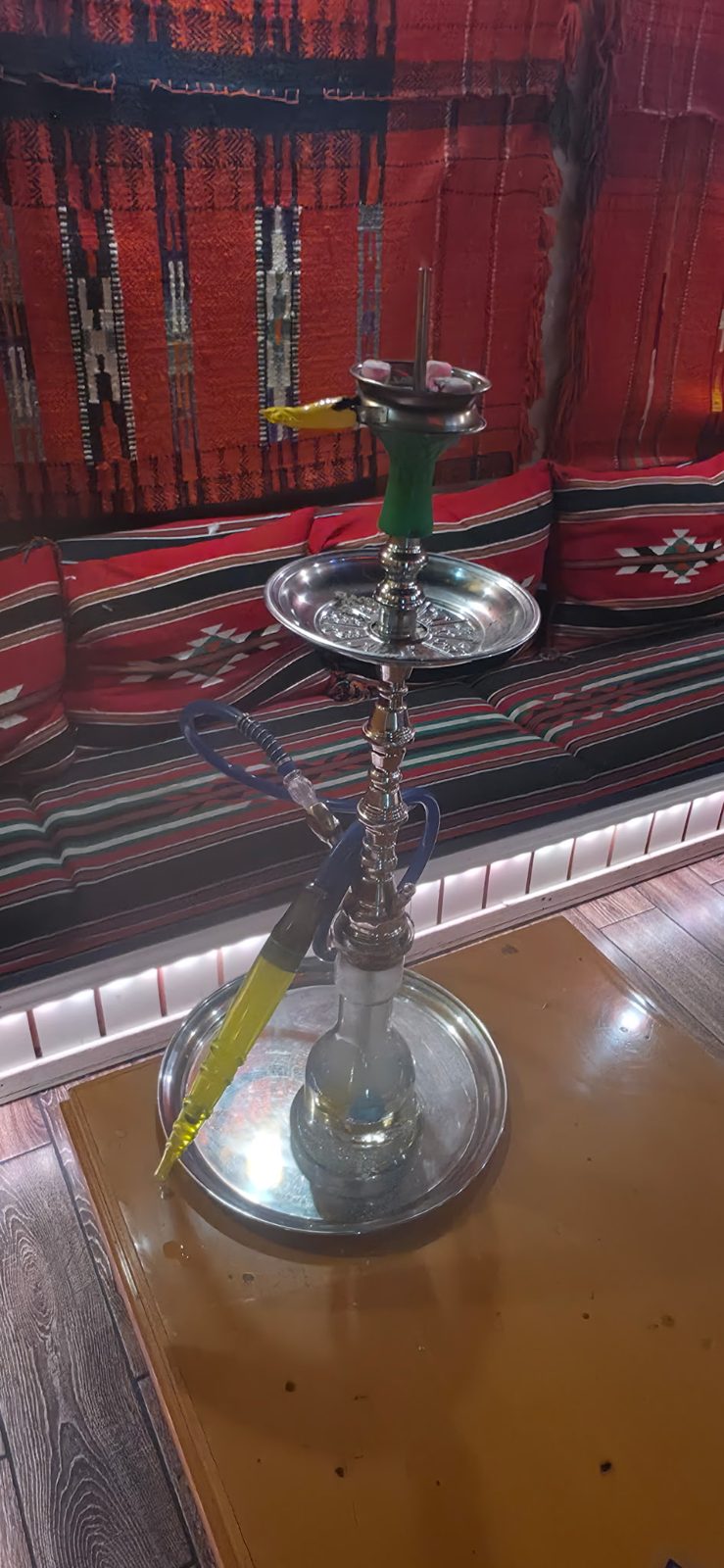Hookah with a green head ready on the table