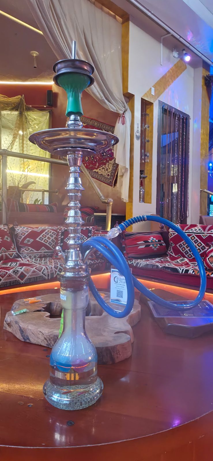 Hookah with a blue hose in the lounge